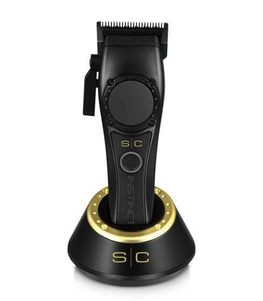 Gold hair trimmer with 'Saber' branding on a white background
