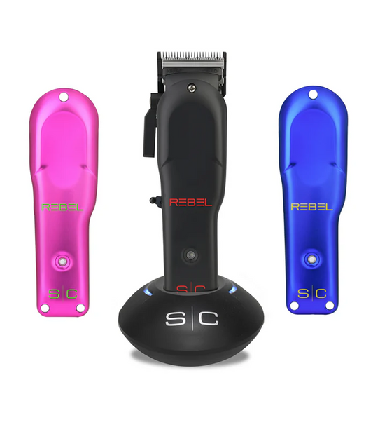 Set of hair clippers with pink and blue attachments on a white background